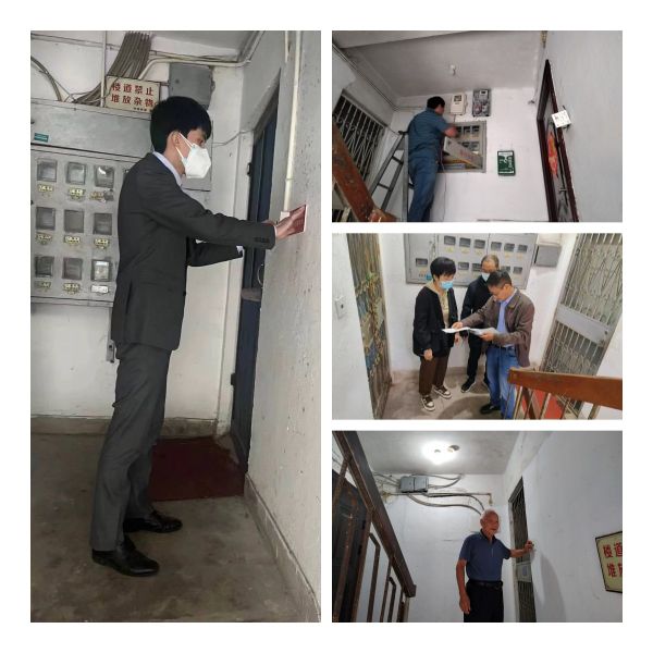 泰隆志愿者张贴楼道灯温馨提示